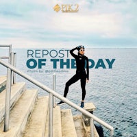 a woman is posing on a set of stairs with the words rep of the day